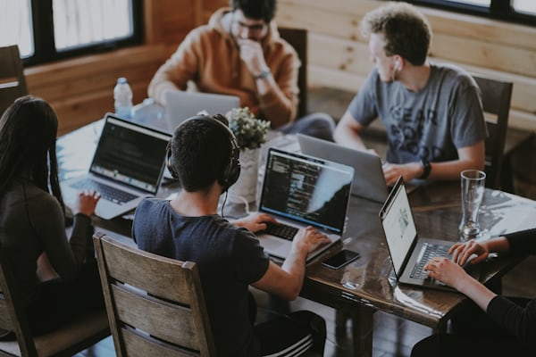 Remote developers collaborating on laptop